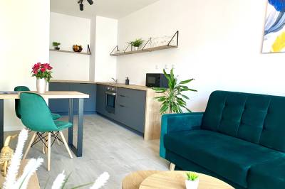 Obývačka prepojená s kuchyňou, Apartment Malá Praha, Žilina