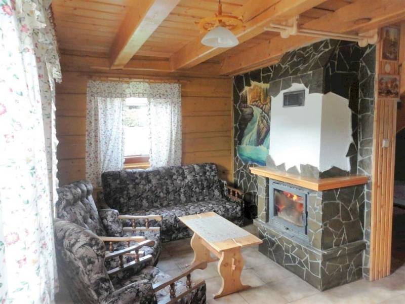 Obývačka s krbom a gaučom, Chata Bea, Jezersko